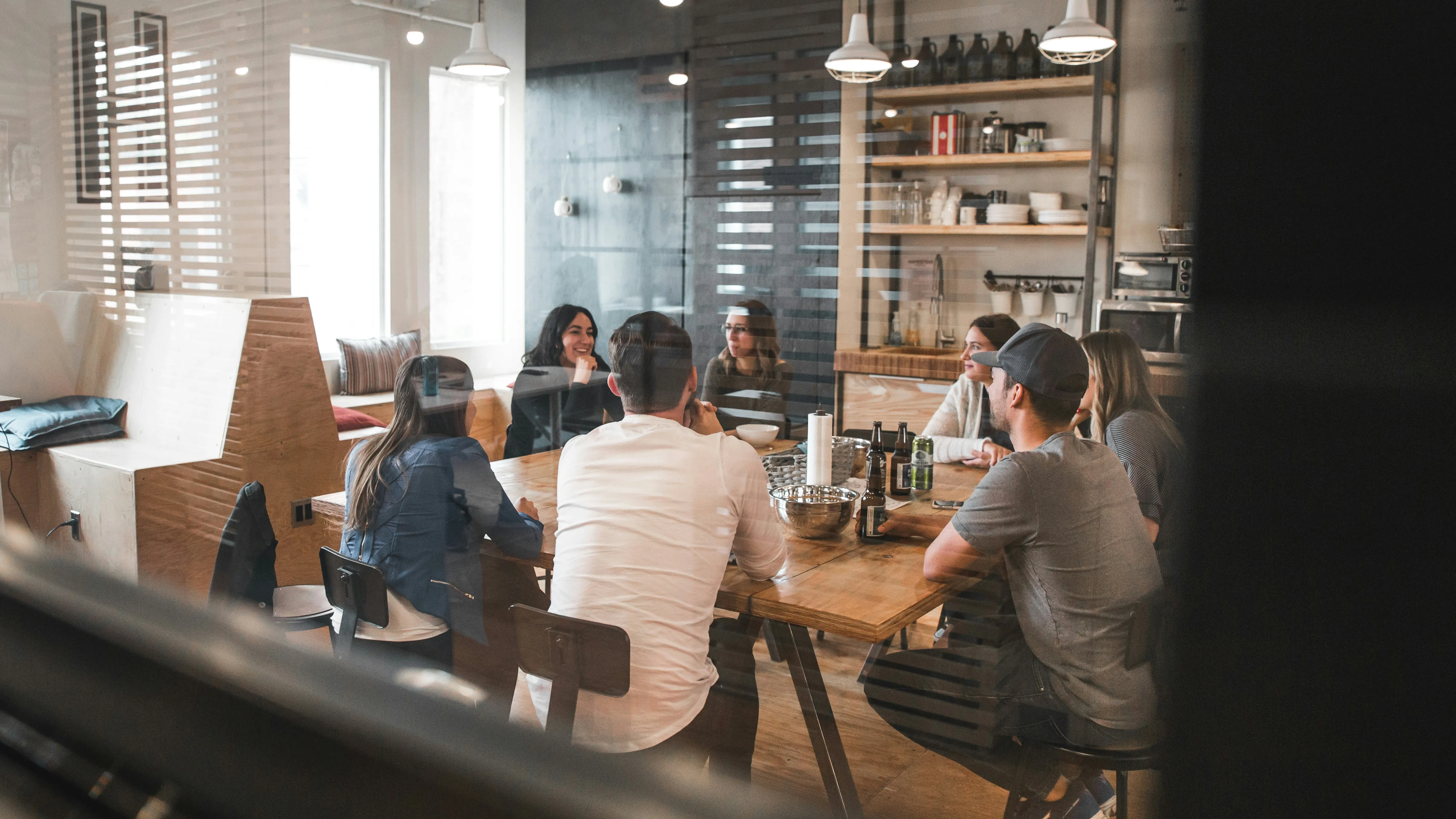 Employees meeting to discuss closing the prevention gap in workplace mental health spending