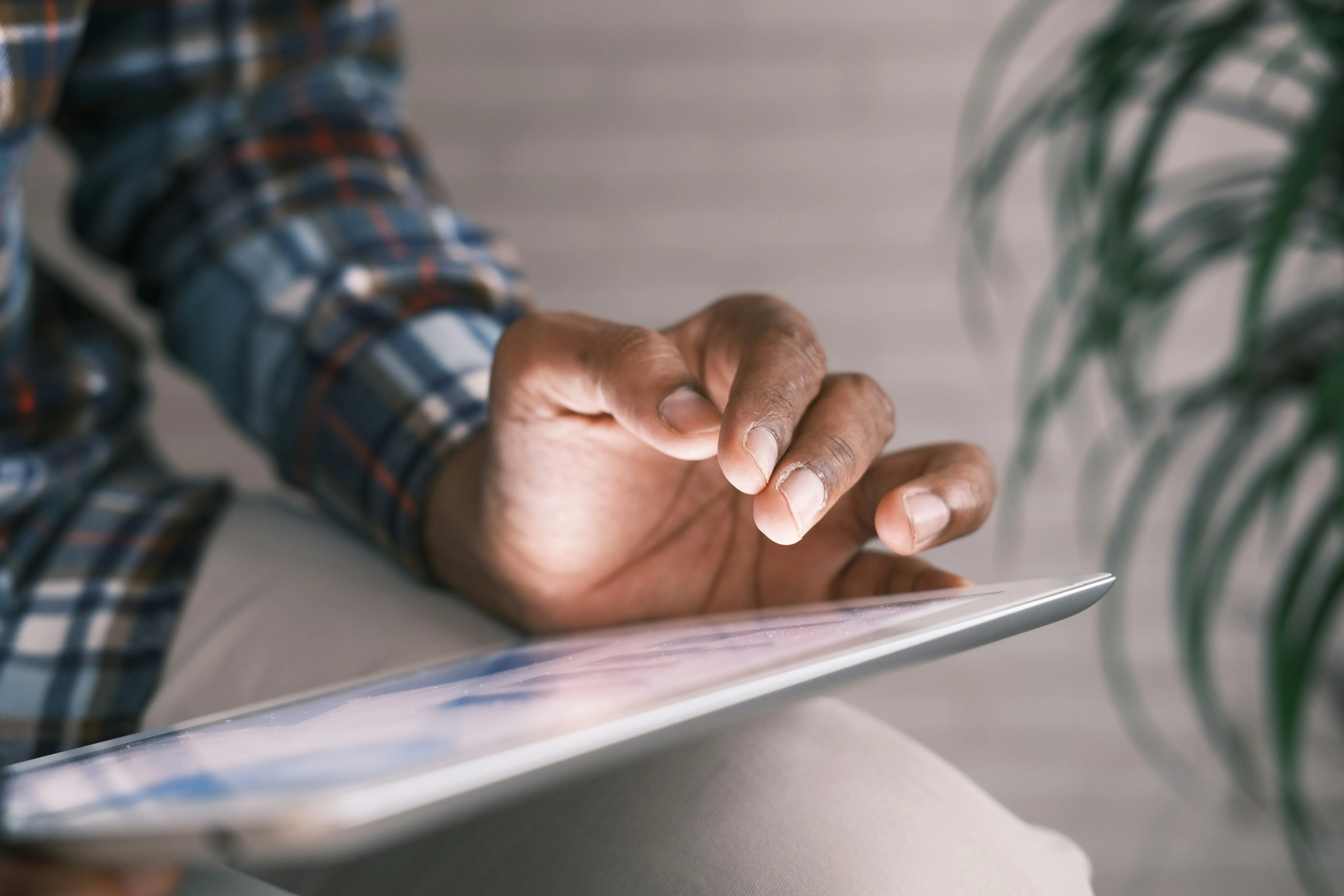 Employee using a tablet to access the Champion Life digital employee benefits hub